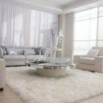 Elegant-white-fur-rug-with-Best-wooden-laminate-flooring-and-sofa-chairs-for-living-room-Ideas